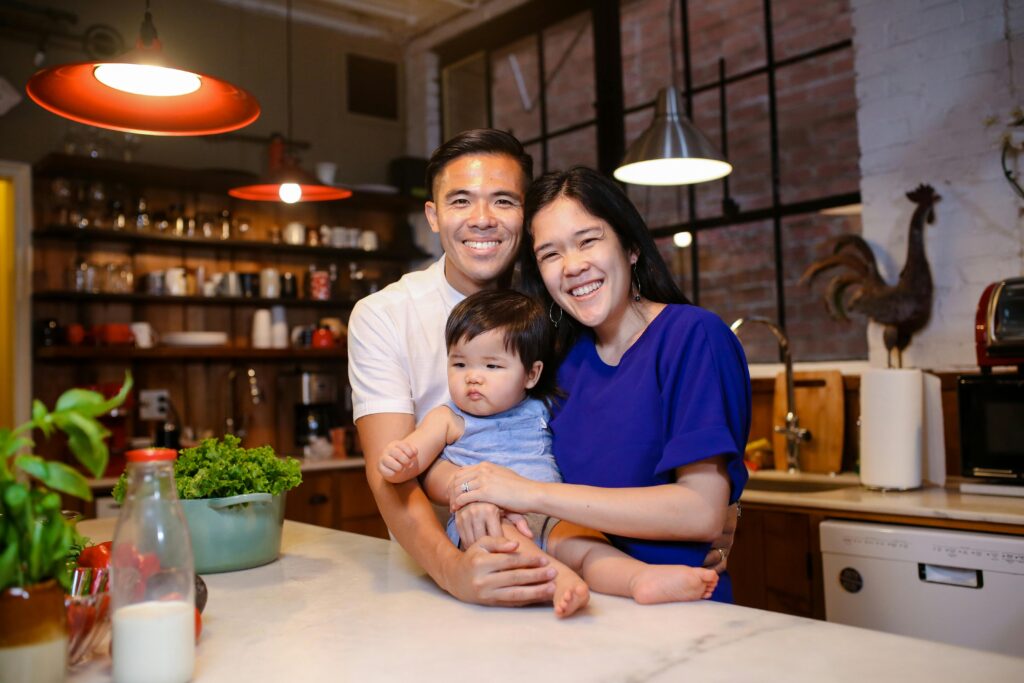 A happy family spending quality time together in their warm, cozy kitchen.